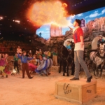A man does a fire-breathing trick at Dolly Parton's Stampede in Pigeon Forge, TN.