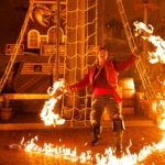 A pirate performer carries out a fire act on a ship at Pirates Voyage Dinner & Show in Pigeon Forge, TN.