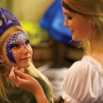 A girl receives a mermaid makeover at Pirates Voyage Dinner and Show in Pigeon Forge.