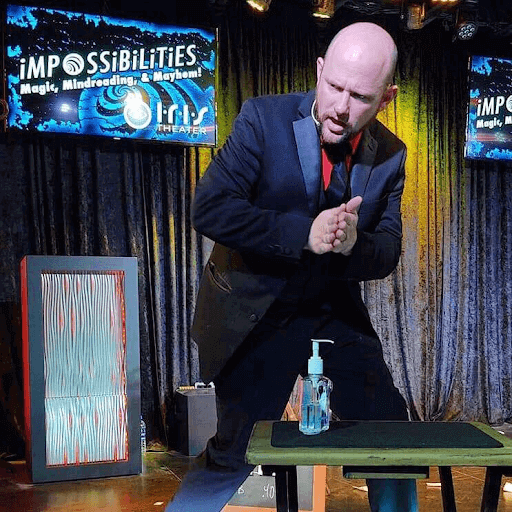 magician performing at Impossibilities Magic Show