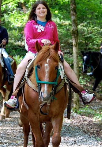 girl riding horse at Sugarlands Riding Stables - Gatlinburg